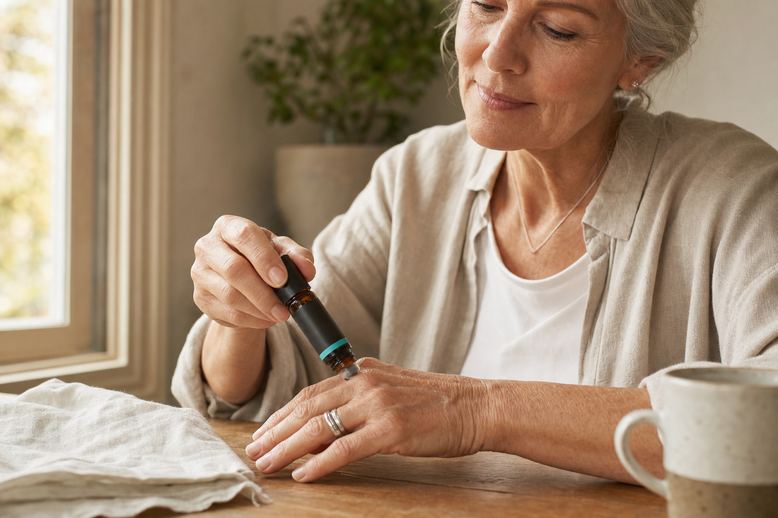 Older woman applying Arkos Pain Pen to her hand